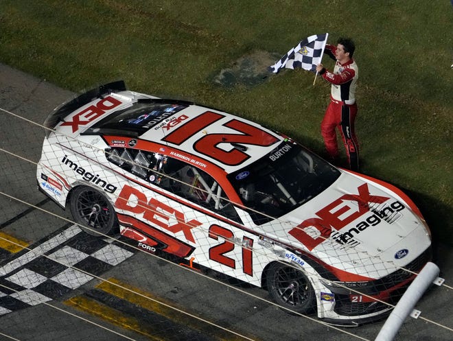 Harrison Burton celebrates winning the NASCAR Coke Zero Sugar 400 at Daytona International Speedway, Saturday, Aug. 24, 2024.