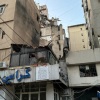 A view of buildings shows damage after what security sources said was a strike on Beirut's southern suburbs, on Tuesday.