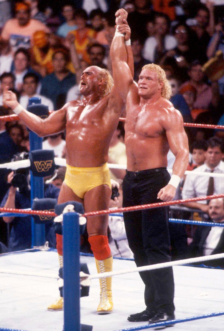 Sid Eudy and  Hulk Hogan with raised hands