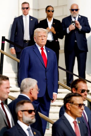 Republican presidential nominee Donald Trump looks on during a wreath laying ceremony at Arlington National Cemetery on Aug. 26, 2024, outside Washington, D.C.