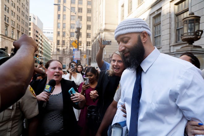 Adnan Syed, whose case was chronicled in the hit podcast “Serial,” leaves the courthouse after a judge overturned his 2000 murder conviction during a hearing at the Baltimore City Circuit Courthouse in Baltimore, Maryland, on Sept. 19, 2022.