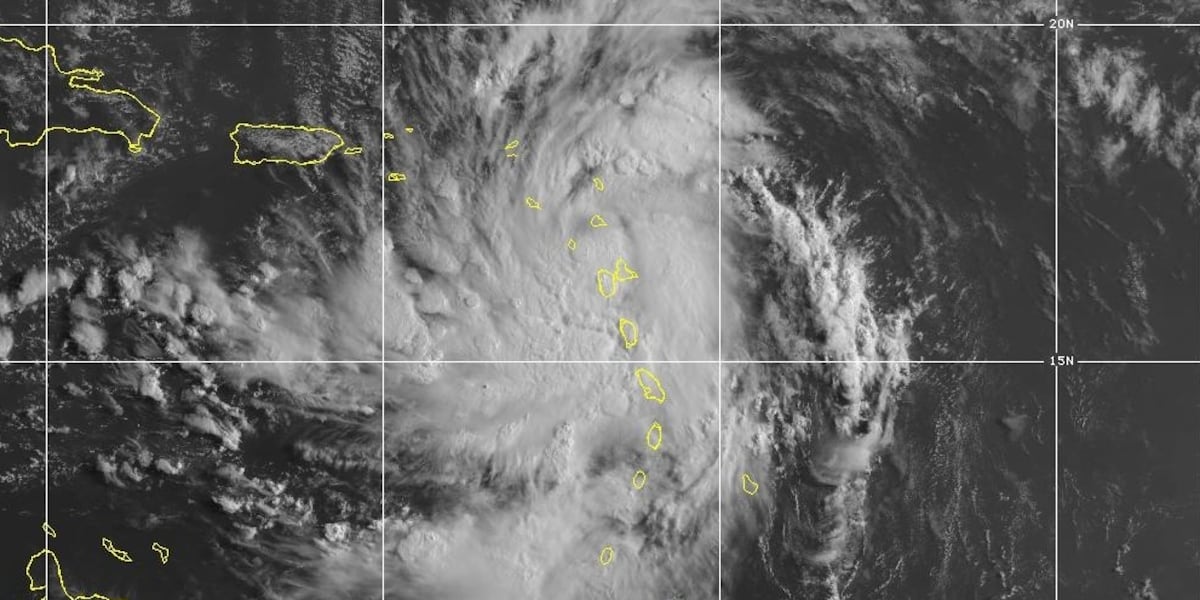 A strengthening Ernesto is poised to become a hurricane after brushing past Puerto Rico