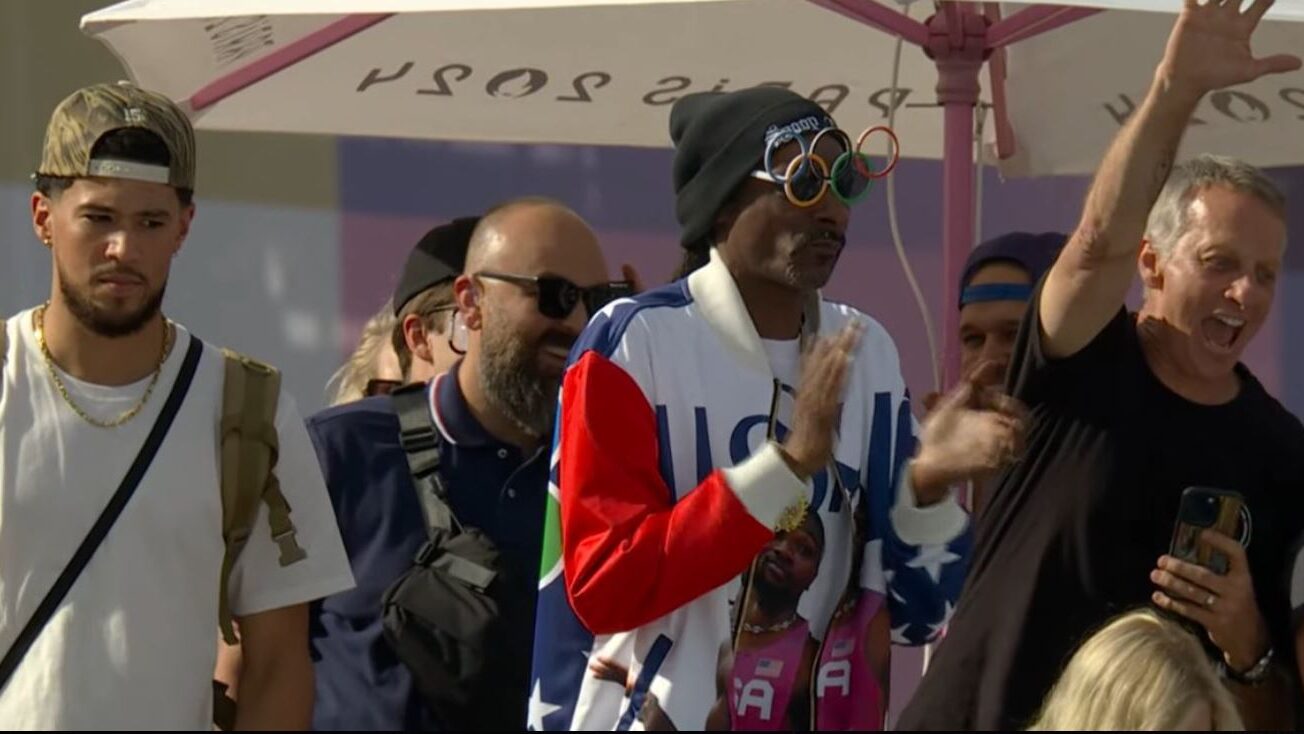 Screenshot of Devin Booker, Snoop Dogg and Tony Hawk watching the Paris Olympics park skateboarding...