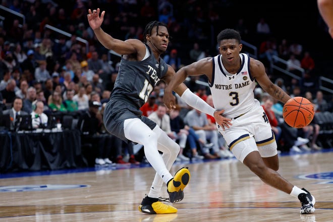 Mar 12, 2024; Washington, D.C., USA; Notre Dame Fighting Irish guard Markus Burton (3) drives to the basket as Georgia Tech Yellow Jackets guard Miles Kelly (13) defends in the second half at Capital One Arena. Mandatory Credit: Geoff Burke-USA TODAY Sports