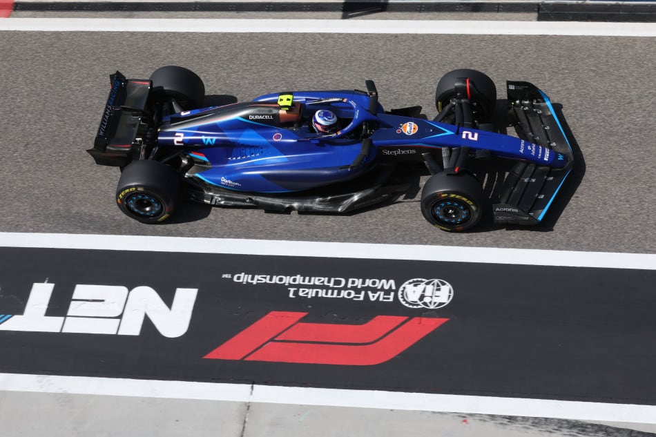 Logan Sargeant (No. 2) drives the Williams FW45 through the pit lane at the Sakhir International Circuit during 2023 Formula 1 preseason testing.