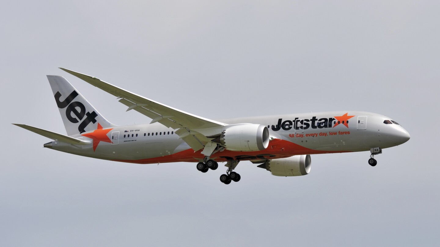 Man opens plane's door and walks on wing at Australian airport before he's arrested