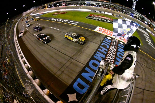 You see the smoke in the background from Joey Logano's car, and you see Denny Hamlin veering to the wall, all of it in the wake of Austin Dillon taking the checkers at Richmond.