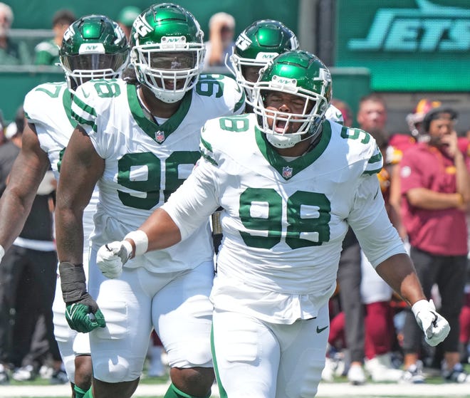 East Rutherford, NJ -- August 10, 2024 -- Bruce Header of the Jets after he sacked Marcus Mariota of the Commanders in the first half as the Washington Commanders came to MetLife Stadium to play the New York Jets in the first press season game of the 2024 season.