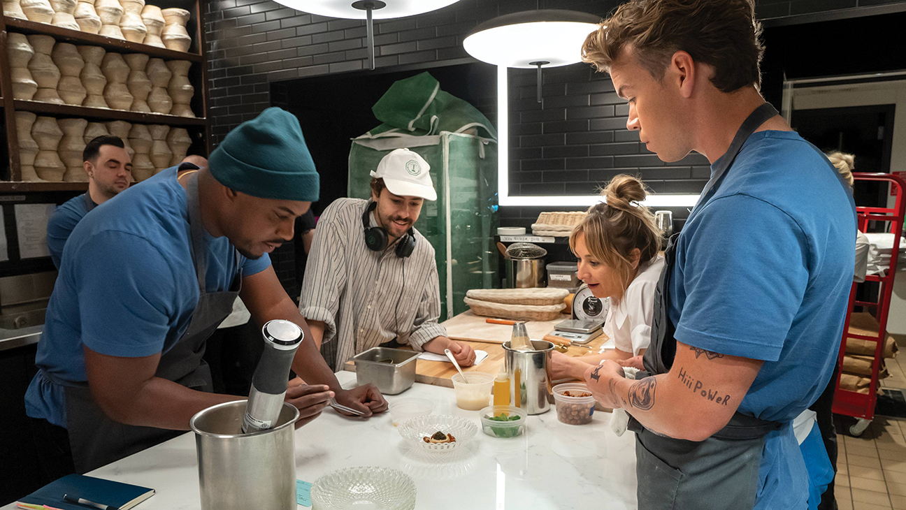 From left: Lionel Boyce, Ramy Youssef, culinary producer Courtney Storer and Will Poulter filming on the set of The Bear.