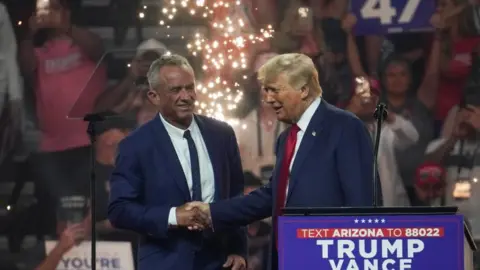 Reuters Donald Trump shakes hands with RFK in Glendale, Arizona, on 23 August 2024