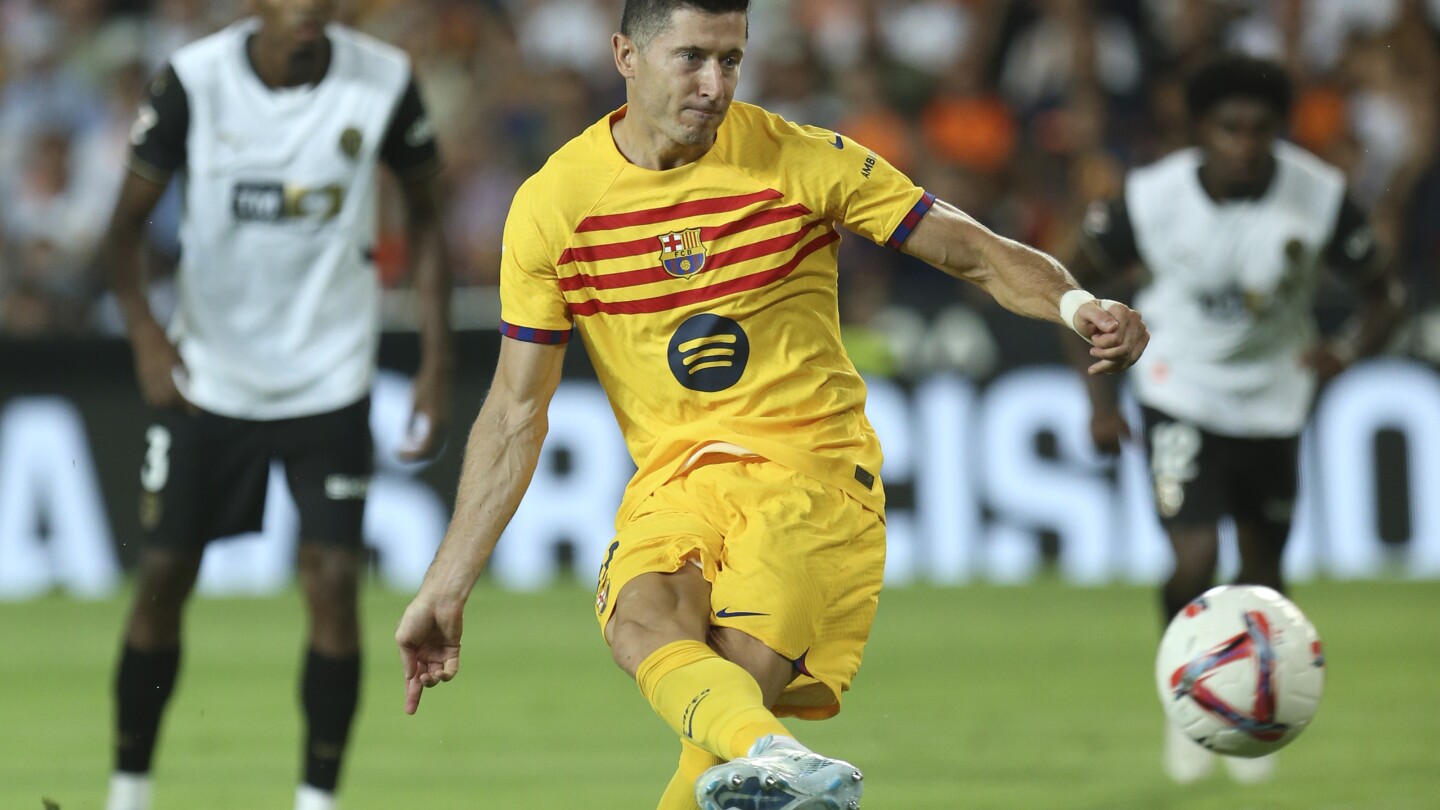 Robert Lewandowski scores twice as Barcelona beats Valencia 2-1 in debut of coach Hansi Flick