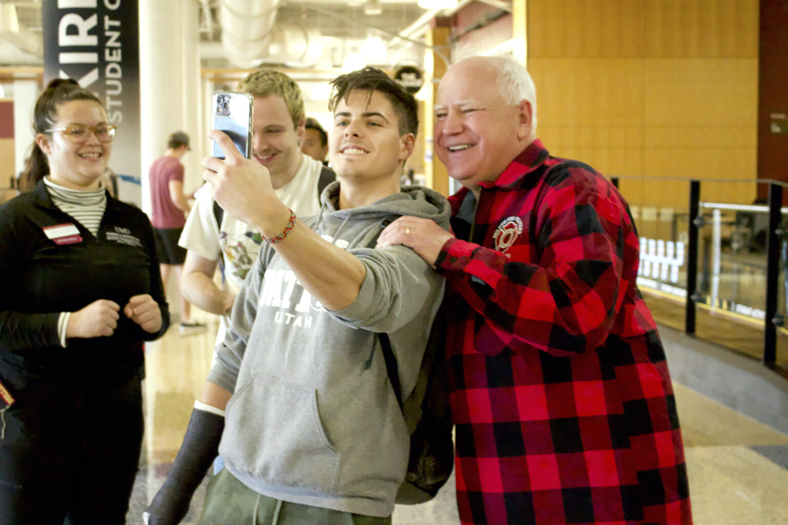 Minnesota Gov. Tim Walz has his photo taken with young fans.