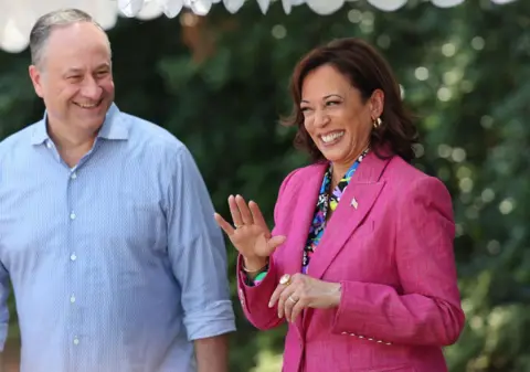 Getty Images Doug Emhoff and Kamala Harris smile