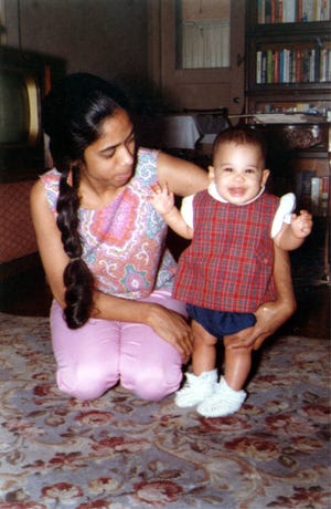 In an undated photo, Vice President Kamala Harris is held by her mother Shyamala Gopalan.