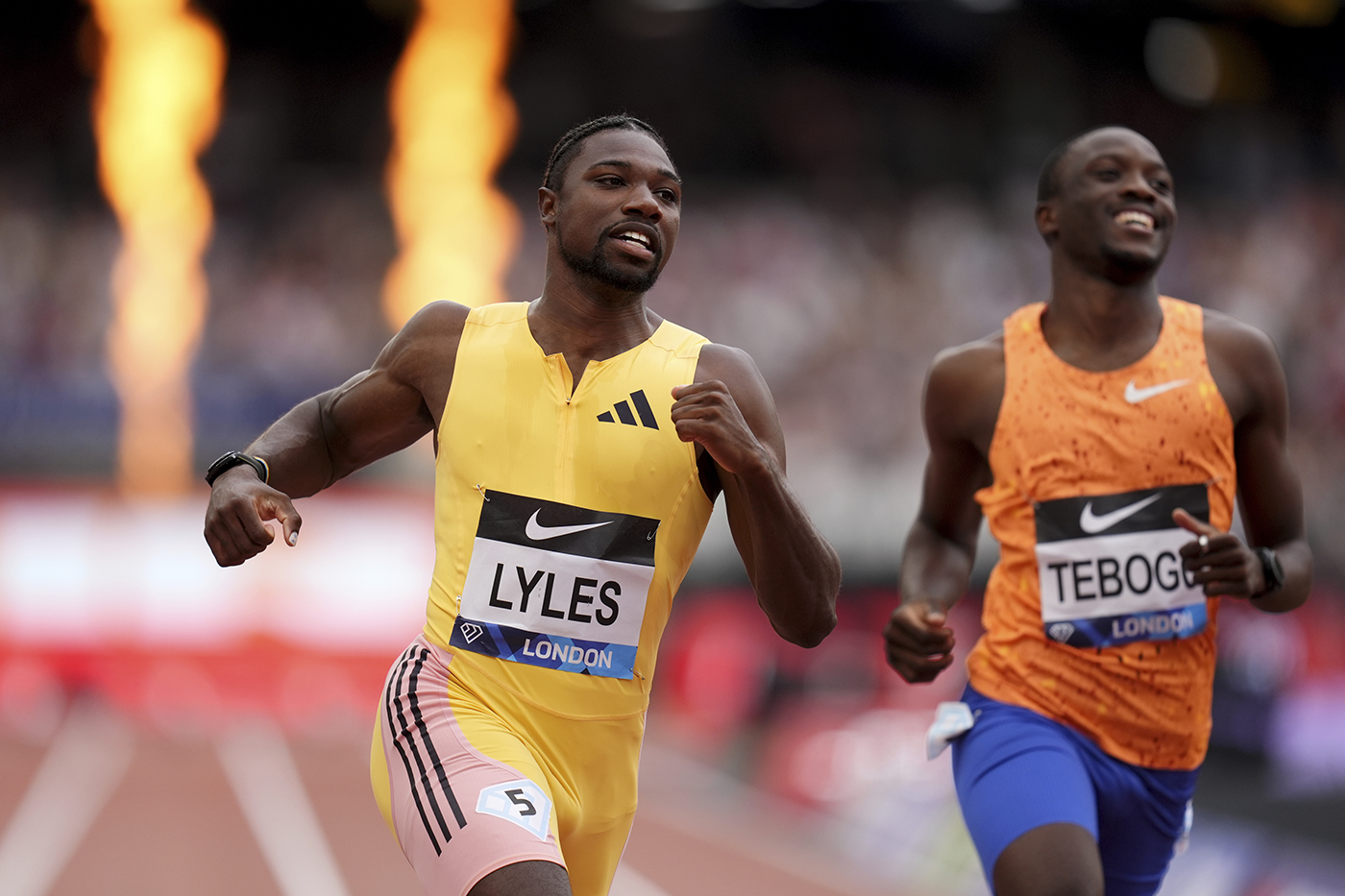 Noah Lyles winning the 100m dash in track.