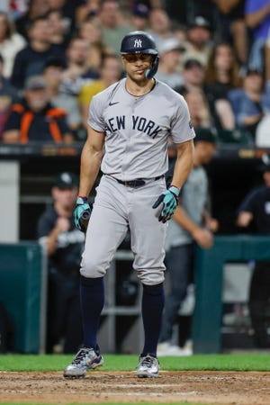 Aug 12, 2024; Chicago, Illinois, USA; New York Yankees designated hitter Giancarlo Stanton (27) reacts after striking out against the Chicago White Sox during the fourth inning at Guaranteed Rate Field. Mandatory Credit: Kamil Krzaczynski-USA TODAY Sports