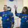 NASA astronauts Butch Wilmore and Suni Williams, wearing Boeing spacesuits, wave as they prepare to depart the Neil A. Armstrong Operations and Checkout Building at Kennedy Space Center for Launch Complex 41 at Cape Canaveral Space Force Station in Florida to board the Boeing CST-100 Starliner spacecraft for the Crew Flight Test launch, on June 5.