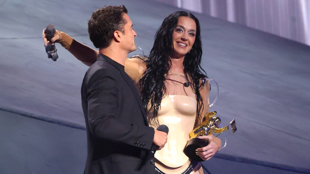 Orlando Bloom Presents Katy Perry With MTV VMAs Vanguard Award