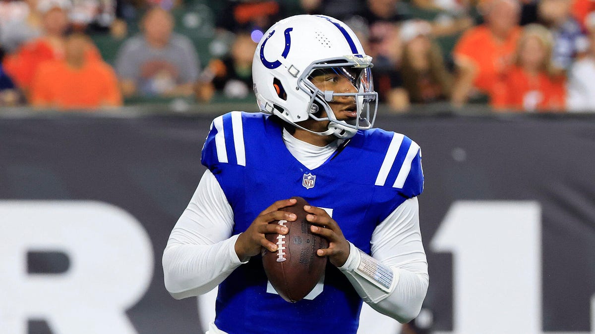 Indianapolis Colts quarterback Anthony Richardson grasping a ball with both hands at his stomach.