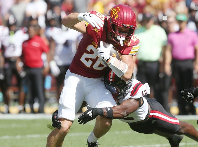 Iowa State Cyclones running back Carson Hansen (26) battle for a few yards as getting a tackle Arkansas State Red Wolves safety Websley Etienne (12) during the first quarter in the week-4 NCAA football at Jack Trice Stadium on Saturday, Sept. 21, 2024, in Ames, Iowa.