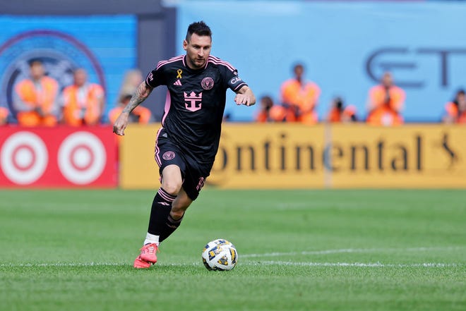 Inter Miami CF forward Lionel Messi (10) dribbles the ball against New York City FC during the first half at Yankee Stadium.