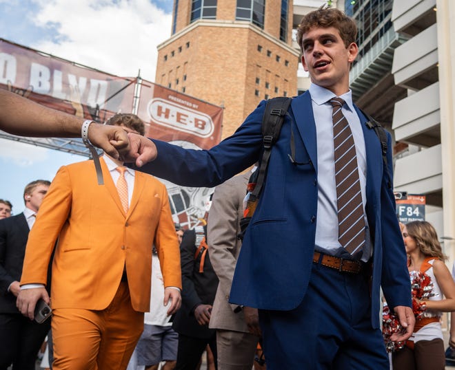 Texas quarterback Arch Manning gives a fist bump as he walks into the stadium ahead of the Texas Longhorns' game against the ULM Warhawks at Royal-Memorial Stadium on Saturday.