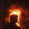 A Ukrainian rescue worker looks on at a burning electrical substation hit by a Russian bomb in the Dnipropetrovsk region in eastern Ukraine on Sept. 2.