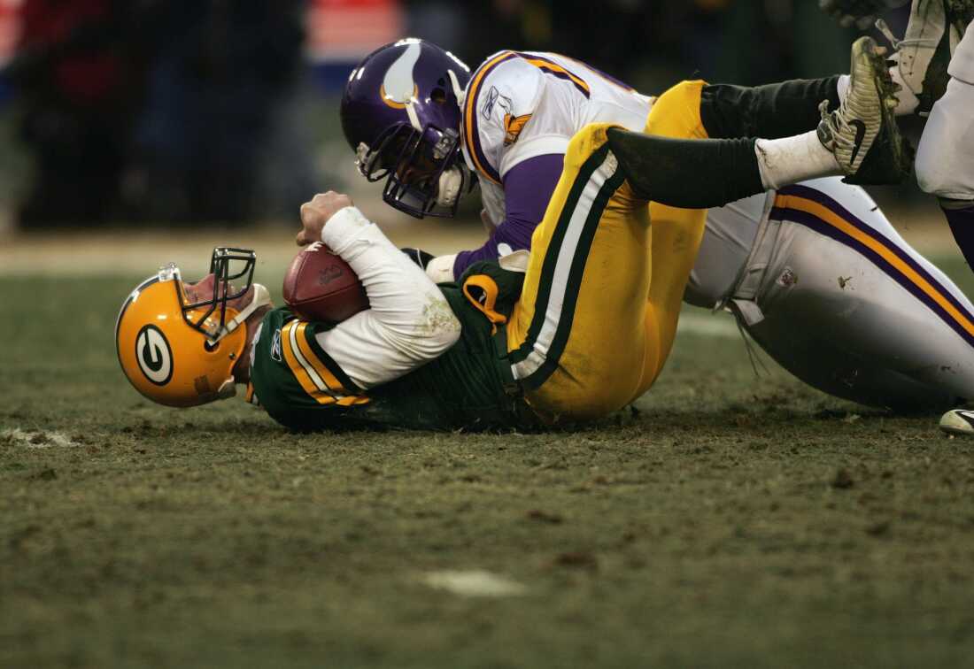 Brett Favre #4 of the Green Bay Packers is tackled by a Minnesota Vikings defensive player during the NFC wild-card game at Lambeau Field on January 9, 2005 in Green Bay, Wisconsin. Favre said Tuesday he's battling Parkinson's Disease after years of concussions in the NFL.