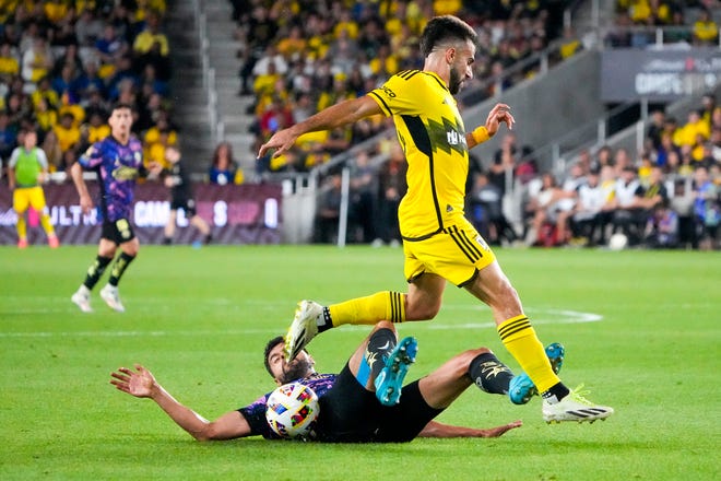 Sep 25, 2024; Columbus, Ohio, USA; Columbus Crew forward Diego Rossi (10) fights for the ball against Club América Néstor Alejandro Araujo Razor (14) in the first half of the Campeones Cup Final at Lower.com Field.