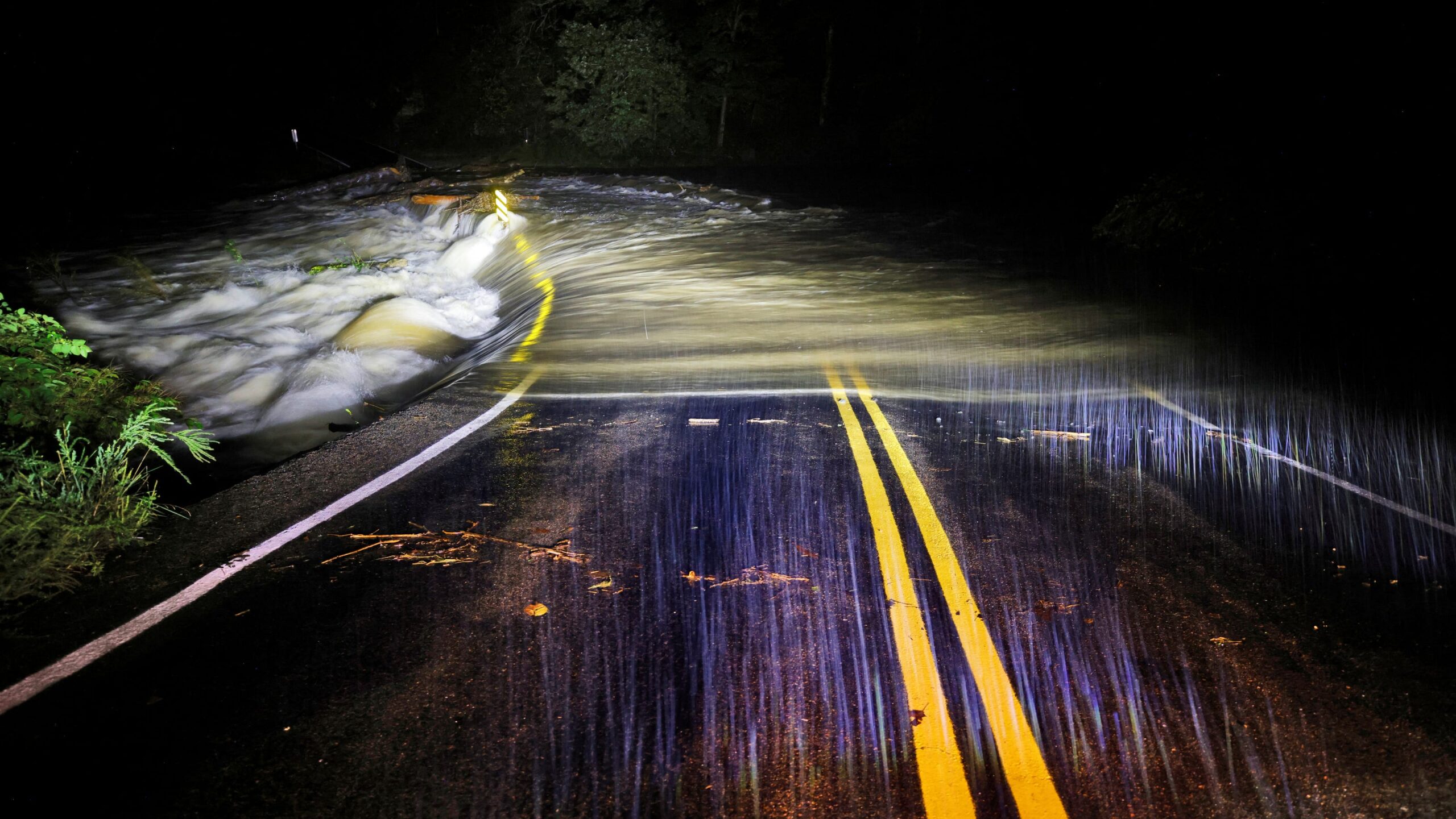 Lake Lure Dam overtops, remains in tact