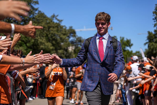 Texas quarterback Arch Manning greets fans ahead of the game against Mississippi State at Royal-Memorial Stadium in Austin Saturday. Manning reportedly will get his second consecutive start against the Bulldogs.