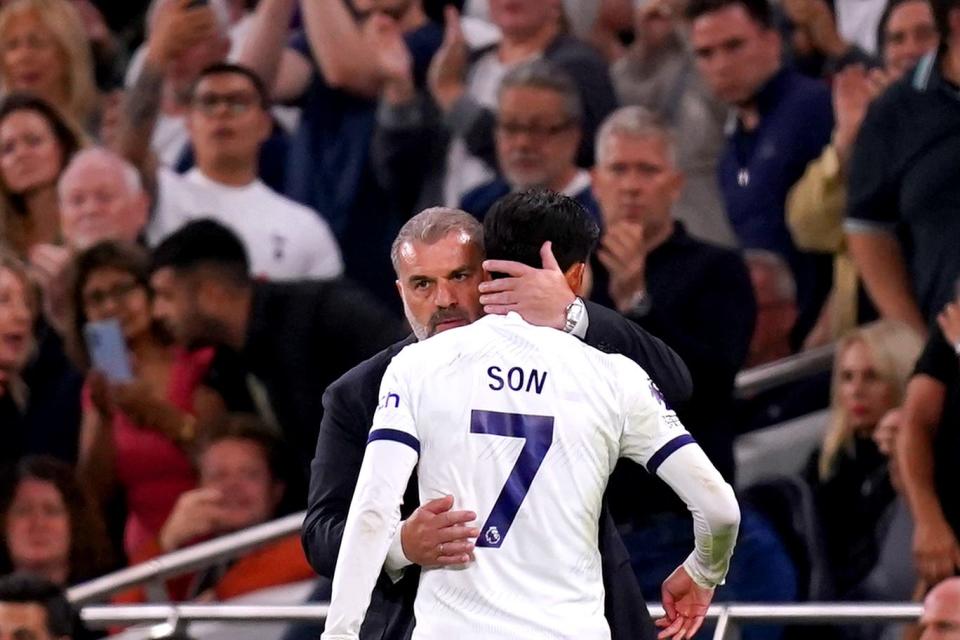 Son Heung-min is hugged by Tottenham manager Ange Postecoglou (John Walton/PA) (PA Archive)