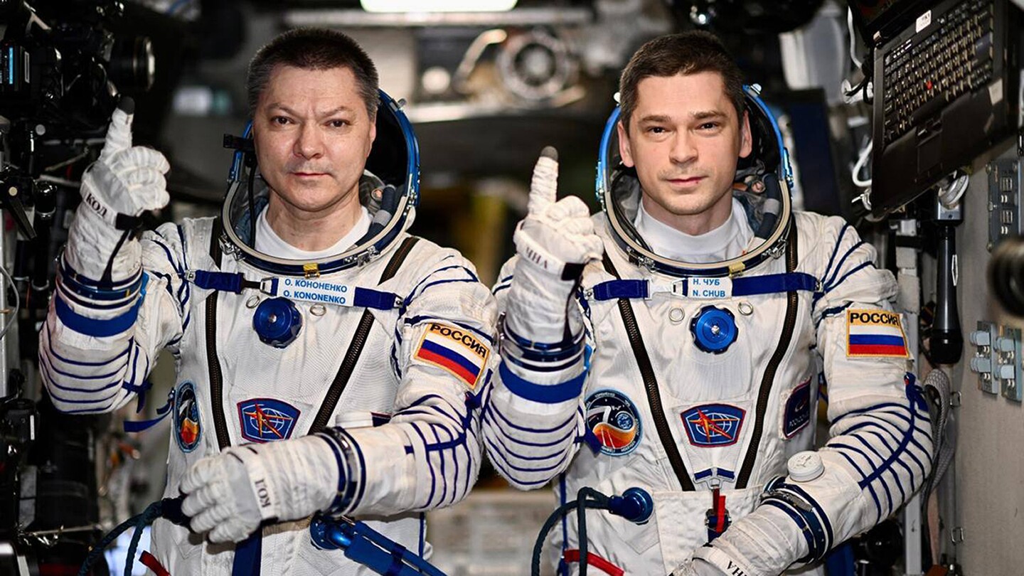 2 Russians set record for longest single stay on the International Space Station