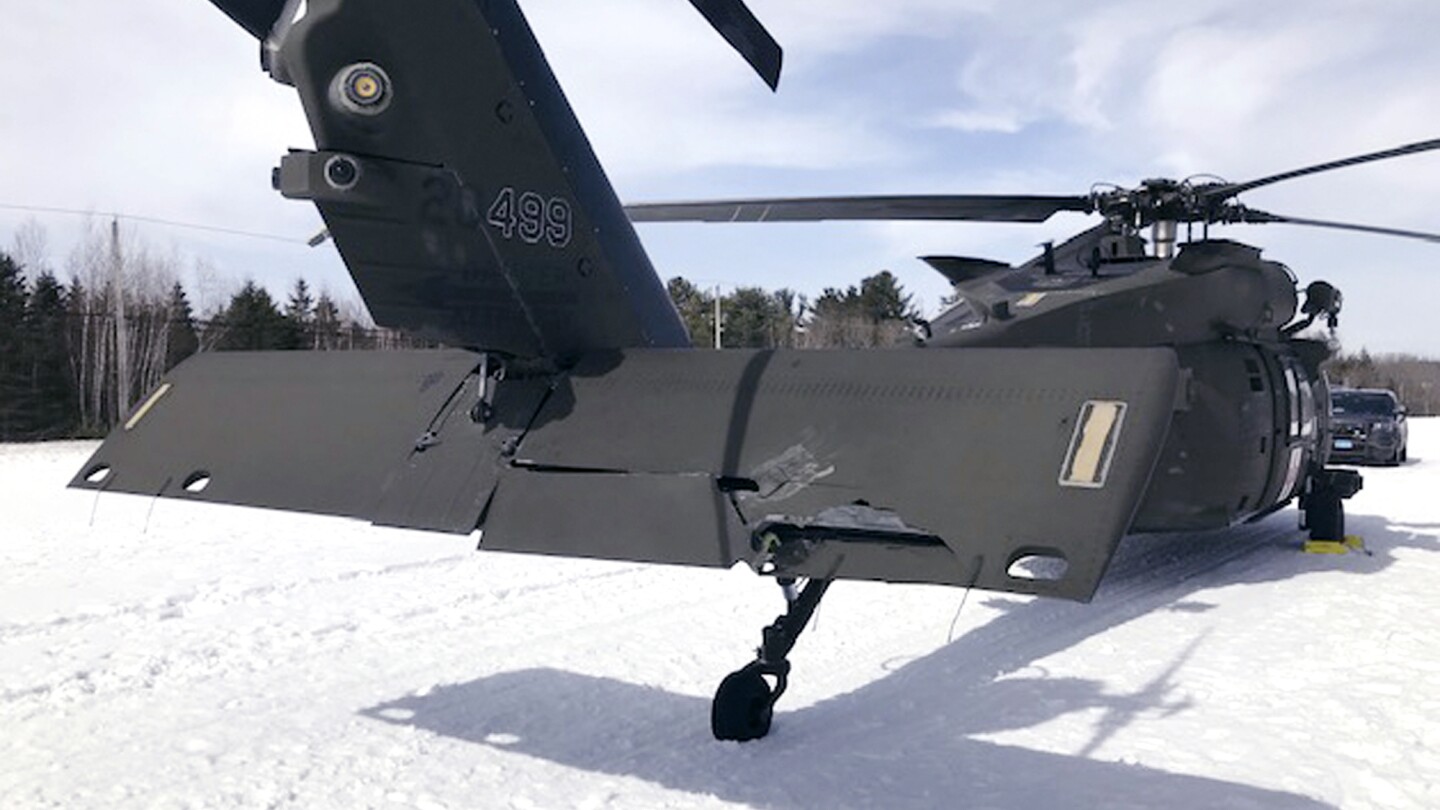 A snowmobiler who crashed into a parked Black Hawk helicopter is awarded $3 million