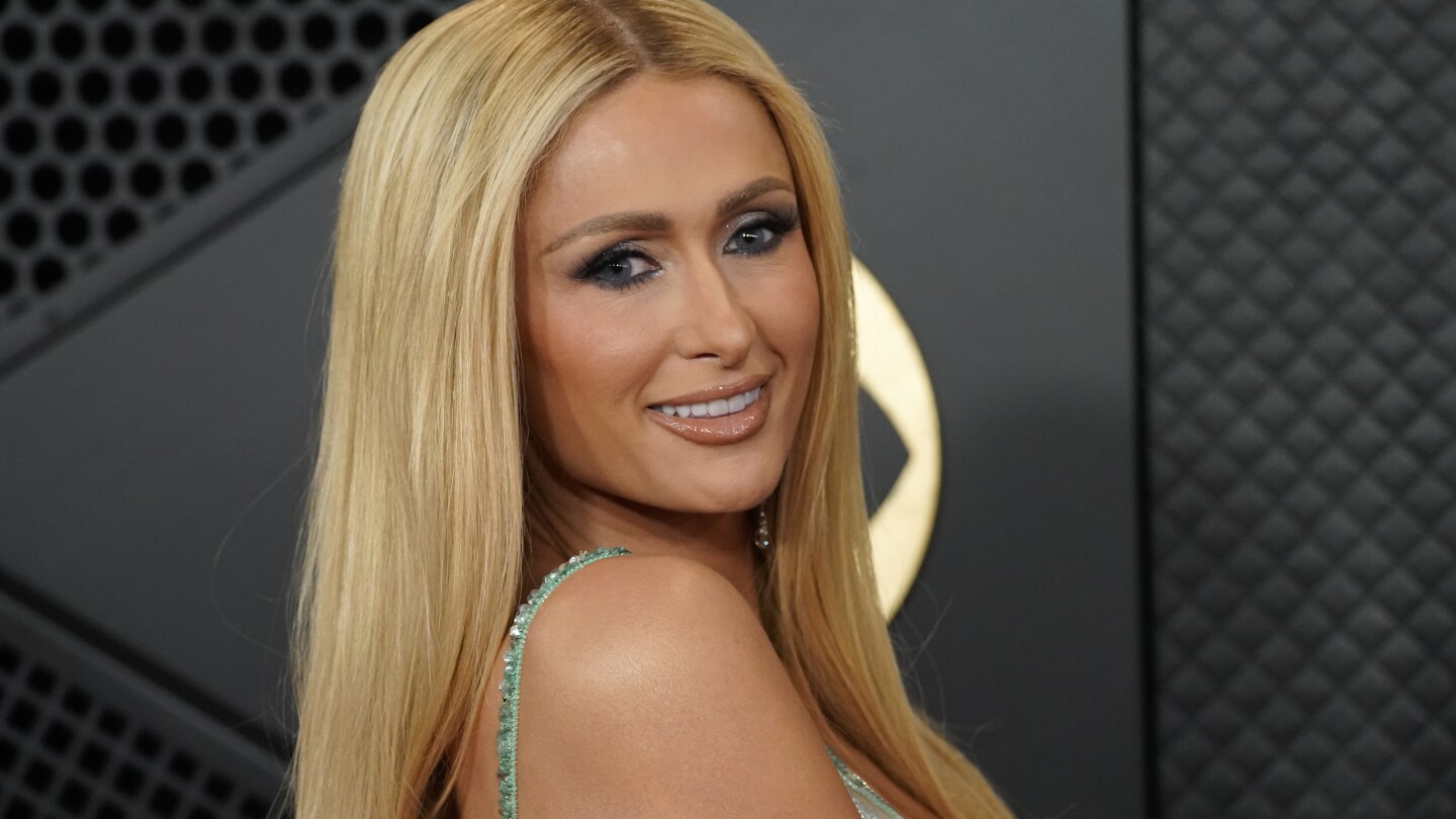 Paris Hilton waited 18 years to drop a new album. On 'Infinite Icon,' she's here to 'save pop music'