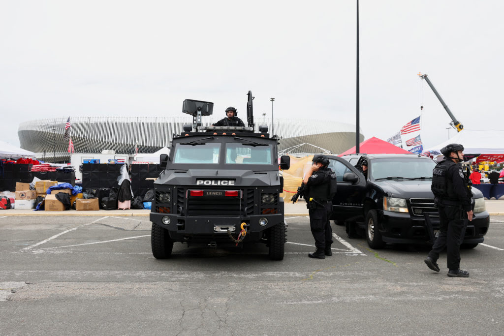 Members of the Nassau County Police Department keep watch outside the Nassau Veterans Memorial Coliseum ahead of a rally h...