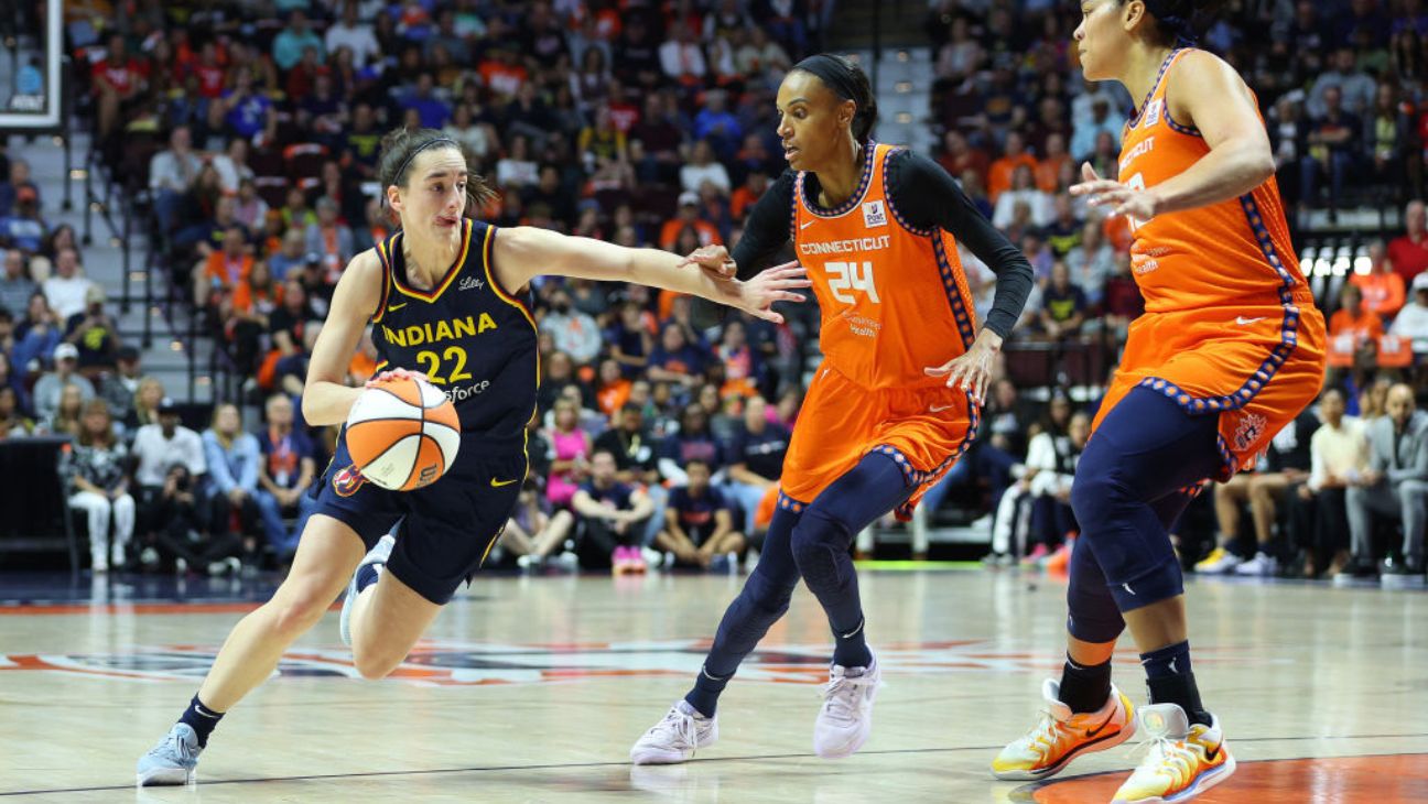 Indiana Fever guard Caitlin Clark drives to the basket against Connecticut Sun's forwards DeWanna Bonner and Brionna Jones (42) during the First Round and game 1 of the 2024 WNBA playoffs.