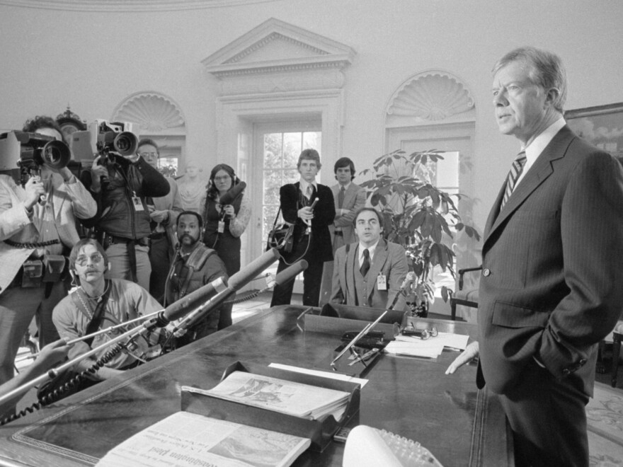 Carter speaks to reporters in the Oval Office in April 1980 about the Iran hostage crisis. Student militants stormed the U.S. Embassy in Tehran in November 1979 and held more than 50 staffers hostage for 444 days. The crisis dominated headlines and helped lead to Carter's defeat in the 1980 election.