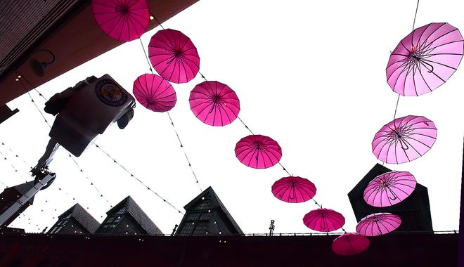 The Pink Power Parasol Project is now hanging in the Cherry Lane Alley behind Central Market in York. About 100 parasols were hung Thursday, September 26, 2024, and will remain there throughout October to bring awareness to Breast Cancer Awareness Month. The North George Street bridge over the Codorus Creek is also decorated. Bil Bowden photo