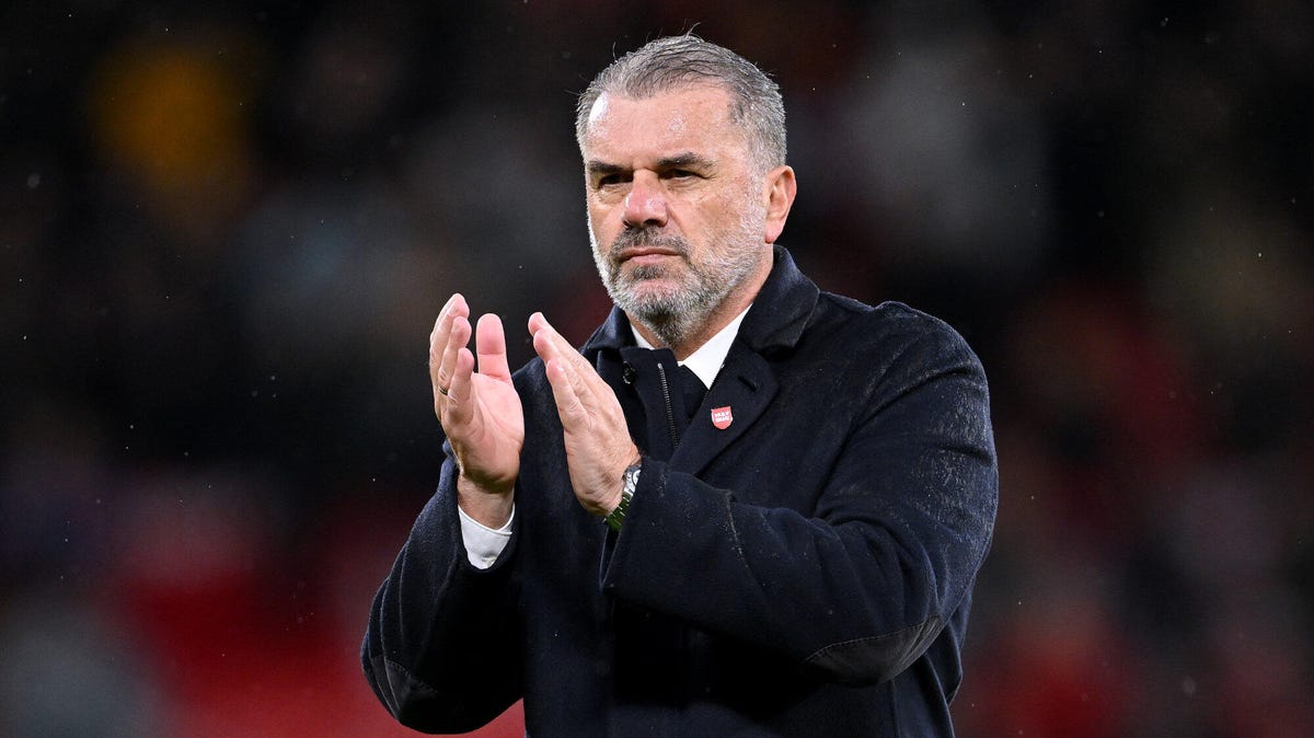 Tottenham manager Ange Postecoglou applauding.