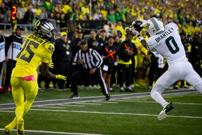 Michigan State Spartans defensive back Charles Brantley intercepts a pass intended for Oregon Ducks wide receiver Tez Johnson as the Ducks host the Spartans Friday, Oct. 4, 2024 at Autzen Stadium in Eugene, Ore.