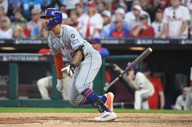 Oct 5, 2024; Philadelphia, PA, USA; New York Mets third baseman Mark Vientos (27) hits a RBI single against the Philadelphia Phillies in the eighth inning in game one of the NLDS for the 2024 MLB Playoffs at Citizens Bank Park. Mandatory Credit: Eric Hartline-Imagn Images