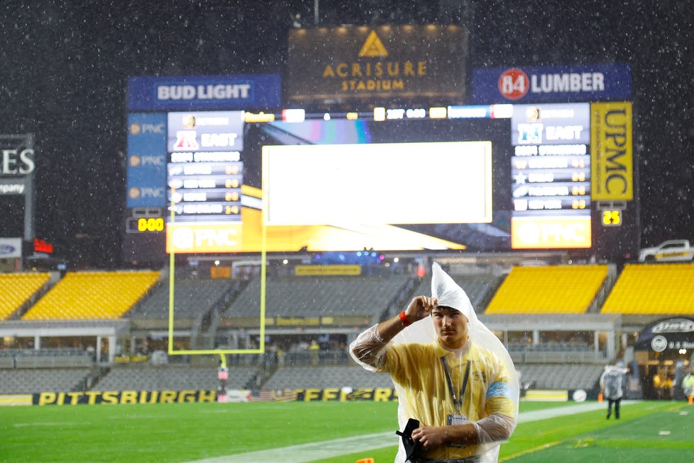 PITTSBURGH, PENNSYLVANIA - OCTOBER 06: A security guard stands in the rain during a rain delay of the game between the Pittsburgh Steelers and the Dallas Cowboys at Acrisure Stadium on October 06, 2024 in Pittsburgh, Pennsylvania. (Photo by Justin K. Aller/Getty Images)