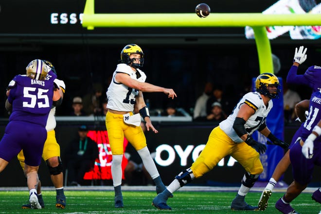 Michigan Wolverines quarterback Jack Tuttle passes against the Washington Huskies during the second quarter at Husky Stadium on Oct. 5, 2024 in Seattle.