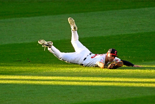 Guardians left fielder Steven Kwan dives to make a catch during the eighth inning against the Detroit Tigers in Game 2 of the ALDS, Oct. 7, 2024, in Cleveland.