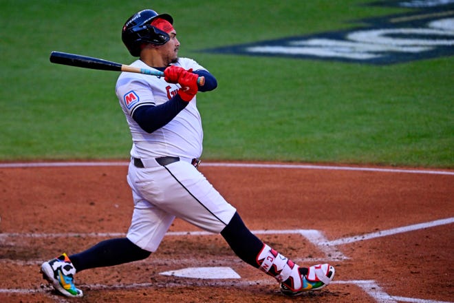 Guardians first baseman Josh Naylor hits a double during the fifth inning against the Detroit Tigers in Game 2 of the ALDS, Oct. 7, 2024, in Cleveland.