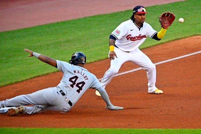 Tigers outfielder Justyn-Henry Malloy reaches third before the throw to Guardians third baseman José Ramírez in the third inning in Game 2 of the ALDS, Oct. 7, 2024, in Cleveland.