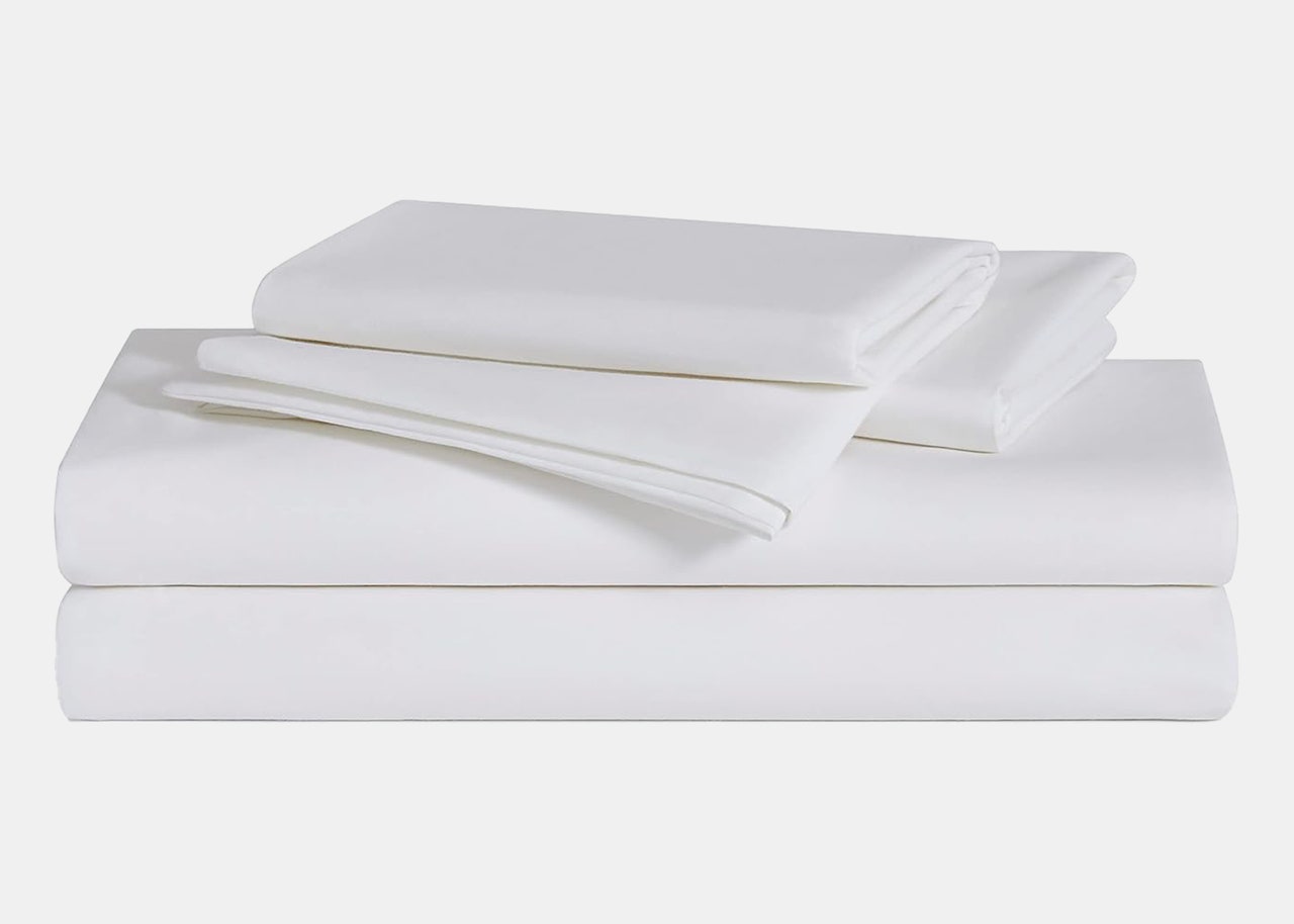 A stack of white sheets and pillowcases 