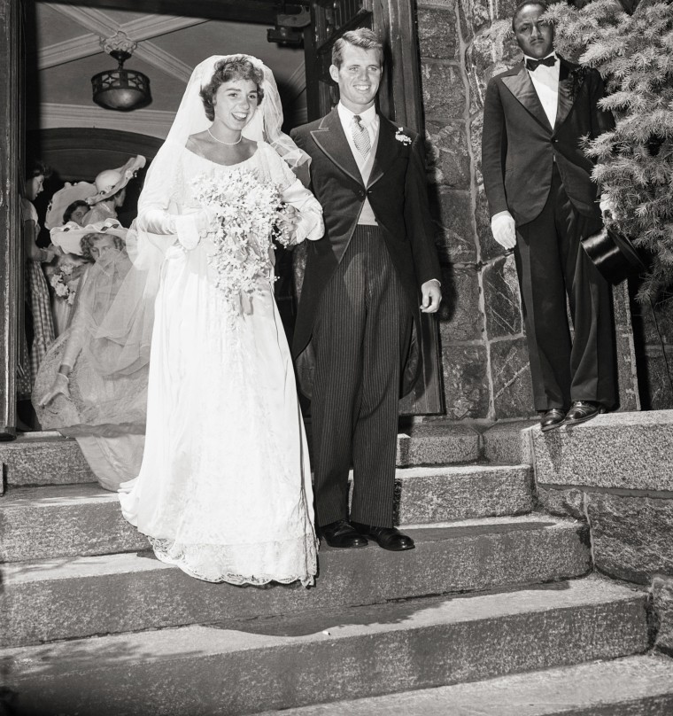 Robert F. Kennedy and Wife Leave Church, walking down steps in wedding dress and wedding suit