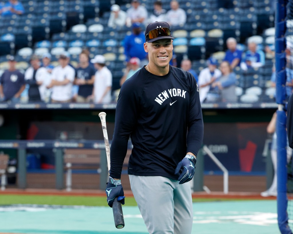 Yankees outfielder Aaron Judge smiles during practice before the start of Game 3.